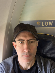 A selfie of me on a plane, heading to the Spain to go on the work offsite